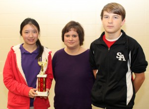 Seventh grade silver winners are, from left, Victoria Gong, adviser Laura Bunch, Greyson Parham, St. Aloysius.