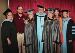 The Bates siblings gather before the graduation ceremony where Carlie and Kayla Bates received their associate degrees. From left are Jackie Granberry, vice president for Advancement and Student Success, Patrick Bates, current Hinds CC student on the Raymond Campus, Carlie Bates, Dr. Clyde Muse, Hinds Community College president, Kayla Bates, Kristin Bates, current Hinds CC student on the Rankin Campus, and Dr. Sue Powell, vice president for both the Rankin and Jackson Campus-Academic/Technical Center. The Bates family is from Pisgah. 