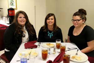 Emilee Ware of Byram, Kimberly Smith of Crystal Springs and Shelby Little of Brandon enjoy lunch together at Hinds Community College’s 2014 Student Leadership Conference Sept. 23. Ware, who attended the conference with her Phi Theta Kappa chapter, said she attended in order to improve her leadership and interview skills. 