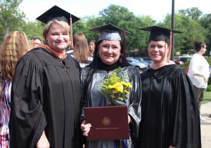 Michelle Cotton of Vicksburg, center, graduated from Hinds Community College on May 14 with a degree in Health Care Assisting. She is with the two instructors who helped keep her in school after her husband died in March, Elinda Hagan, left, and Greer Duran.