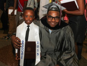 Christopher McCollum of Jackson graduated from Hinds Community College on May 15. Celebrating with him is his nephew Jeremiah Williams, 5.