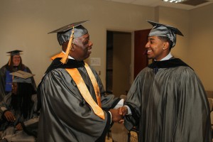Associated Student Government members Abram Muhammed of Jackson, left, and Nathan Murrell of Vicksburg get ready to graduate from Hinds Community College on May 15.