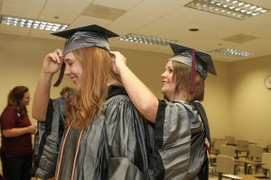 Taylor Wages of Pearl, left, and Donielle Hartt of Pearl get ready for graduation on May 14 at Hinds Community College. Both received an Associate Degree in Nursing.