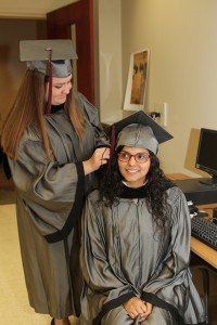 Lacy Pippin of Flowood, standing, and Ana Recinos of Pearl graduated from Hinds Community College on May 14 with an Associate Degree in Nursing.