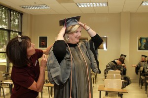 Hinds employee Kathy Price helps Kelly Parker of Brandon get ready for graduation on May 14 at Hinds Community College. Parker, 47, was a sales representative before deciding to go to nursing school. “This was my dream,” she said. She already had a degree in marketing from the University of Southern Mississippi. 