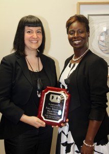 Nina Ghaffari, guest speaker at Friday’s ceremony to recognize those who received a General Education Development certificate this academic term, receives a plaque from Carla Causey, district director of Adult Education at Hinds Community College.