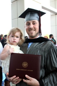 David Thames of Brandon received an Associate Degree in Nursing from Hinds Community College on July 30. He is holding daughter Hartlee, 20 months.
