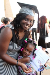 Calmesha Williams of Vaughn celebrates her July 30 graduation from Hinds Community College with a dental assisting degree with family members including cousin Trayriah Young.