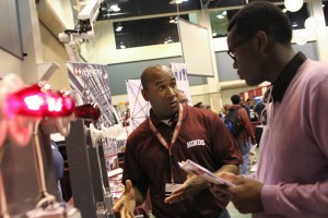 Hinds Community College Electrical Technology Instructor Timothy White speaks with Tevin Sylvester, a Vicksburg High School senior. High school students from the Vicksburg area visit a Career Expo at the Vicksburg Convention Center on Thursday, October 22, 2015. )Hinds Community College/April Garon)