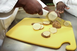 Part of the Culinary Arts program at Hinds Community College's Utica Campus includes proper knife work with common food items, such as potatoes. (April Garon/Hinds Community College)