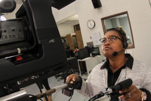 First-year Television and Radio Broadcast student Alayshia Martin eyes up a shot during a practice shoot at the program's studio on the Utica Campus. (April Garon/Hinds Community College)