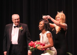 Miss Hinds Community College 2015 Maggie Shoultz crowns Courtney Helom, of Jackson, as Miss Hinds Community College 2016 as Hinds President Dr. Clyde Muse looks on during this year's pageant Feb. 3. Helom is a sophomore at the Raymond Campus studying biology. Her platform is "Girl Scouts of America: beYoutiful". The pageant is an official preliminary pageant of the Miss America Pageant program. (April Garon/Hinds Community College)