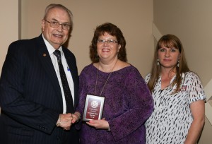 Deborah Campbell, center, was among Hinds Community College Students recognized with a departmental award April 15. Campbell received an Outstanding Student Award for Health Information Technology, presented by Hinds President Dr. Clyde Muse, left, and instructor Michelle McGuffee, right. 