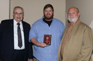 Matt Holloway, center, was among Hinds Community College students recognized with a departmental award April 15. Holloway received an Outstanding Student Award for Aviation Maintenance Technology by Hinds President Dr. Clyde Muse, left, and instructor Marion Eifling, right.