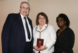 Lesa Marie Hutchens, center, was among Hinds Community College students recognized with a departmental award April 15. Hutchens received an Outstanding Student Award for Paralegal Technology by Hinds President Dr. Clyde Muse, left, and instructor Shivochie Dinkins, right.