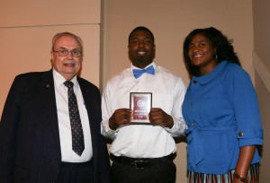 Jarvis Jones, center, was among Hinds Community College students recognized with a departmental award April 15. Jones received a Community Service Award from Hinds President Dr. Clyde Muse, left, and English instructor Apryl Trimble, right.
