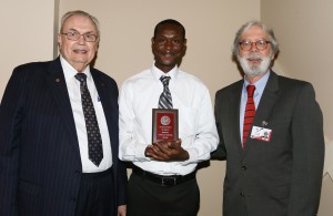 Cyprian Ngetich, center, was among Hinds Community College students recognized with a departmental award April 15. Ngetich received an Outstanding Student Award for Biology, presented by Hinds President Dr. Clyde Muse, left, and Rankin Campus Academic Dean Gary Fox, right.