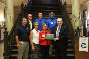 Hinds Community College was given the 2015 Environmental Hero Award as Recycler of the Year for Educational Institutions in Mississippi on April 5 by the Mississippi Recycling Coalition. Front row, from left, Office of Sustainability Director Jason Pope, Sustainability Projects Coordinator Mindy Stevens, Sarah Kountouris of Keep Mississippi Beautiful, Hinds President Dr. Clyde Muse; back row, from left, Vice President Thomas Wasson, student volunteer Talgat Brown and Sustainability's Leon Jackson.