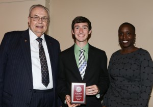 Eric Rush, center, was among Hinds Community College students recognized with a departmental award April 15. Rush received a Leadership Award, presented by Hinds President Dr. Clyde Muse, left, and Computer Science instructor Dr. Johannah Williams, right. 