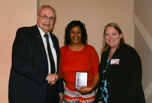 Gwendolyn Antoinette Russell, center, was among Hinds Community College students recognized with a departmental award April 15. Russell received an Outstanding Student Award for Reading, presented by Hinds President Dr. Clyde Muse, left, and instructor Cassandra Varnell, right.