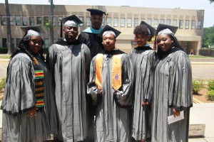 Dr. Mitchell Shears, back row in center, academic dean of the Utica Campus, stands with STEM graduates, from left, Brensha Richardson, Joshua Hodge, Darione Maxie, Classie Bradford and Asia Braxton. (Allison Morris/Hinds Community College)