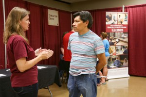 Al Brennan, of Pearl, speaks with Kim Neely, coordinator of Continuing Education for Short Term Programs at the Fall 2016 Nursing Showcase at Hinds Community College Jackson Campus-Nursing/Allied Health Center. (Hinds Community College/April Garon)