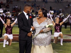 Latashanna Ransom, right, and her escort, Casey Larry, react as Ransom is announced homecoming queen at Hinds Community College during festivities Sept. 22 on the Raymond Campus. (Tammi Bowles/Hinds Community College)