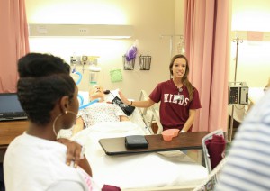 Prospective nursing student Taylor Williams listens as student Jennifer Lariccia talks about the learning lab during a tour at the Hinds Community College Nursing/Allied Health Center Showcase event on Tuesday, Sept. 8, 2015. The event was an open house for prospective students interested in programs offered at the campus. Information booths and learning lab tours were available. 