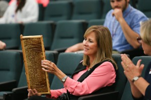 Debbie McCollum, dean of the Honors Institute at Hinds Community College, handles a used honeycomb during the Bee Informed workshop Nov. 9 at Reeves Hall on the Raymond Campus. (Hinds Community College/April Garon)