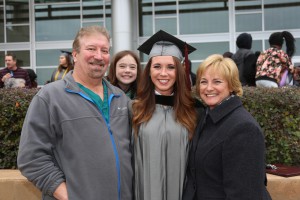 Jamie Johnson, center right, was among nearly 900 graduates of Hinds Community College at ceremonies held Dec. 16. Johnson earned an Associate of Arts degree in general studies and plans to pursue a nursing degree. With her is her father, Jimmy Johnson, left, her daughter, Carlie Blok, and her mother, Beverly Johnson. (Hinds Community College/April Garon)