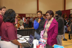 Alicia Foster, foreground right, a senior at Warren Central High School, listens to Simonee Miller and Bryan McCachren, both counselors at Hinds Community College Raymond Campus, during Preview Day on campus Friday, Feb. 3, 2017. With Foster are her parents, Dr. Johnnie Foster and Andrea Foster, of Vicksburg. (Hinds Community College/April Garon)