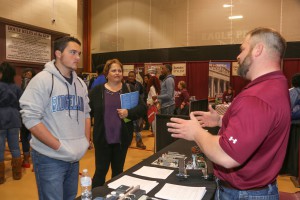Parker Goff, a senior at Ridgeland High School, listens with his mother, Sandra, as Jacob Wright, an Electronics/Biomedical Engineering instructor on the Raymond Campus, explains the program during Preview Day on campus Friday, Feb. 3, 2017. (Hinds Community College/April Garon)