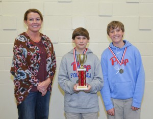 Winning the seventh grade gold award was Jackson Preparatory School including, from left, adviser Tracye Eakes of Flowood, Thomas Wasson of Madison and Worth Hewitt of Jackson.