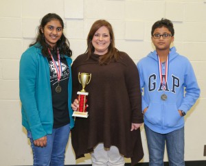 Winning the seventh grade silver award was Clinton Junior High including, from left, Abigail Varsheese, sponsor Christi Oswalt and Abhay Chenuku.