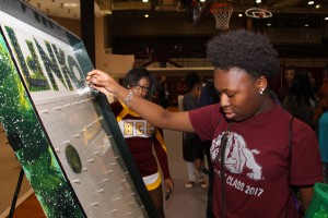 Lanier High School senior Nekimble Anderson of Jackson enjoyed playing Plinko. The future early childhood education major played for prizes and tickets. Her plans are to attend Hinds Community College in fall 2017.