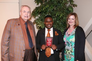 Jeremy Middleton, center, of Canton, was among Hinds Community College students recognized with a departmental award April 21. Middleton received an Outstanding Student Award for Psychology, presented by Hinds President Dr. Clyde Muse, left, and instructor Christine Aycock, right. (Hinds Community College/April Garon)
