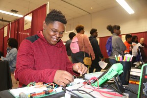 Khourtland Smith, an eighth-grader at Whitten Preparatory Middle School, handles a small-scale simple motor at College Carnival April 7 at Hinds Community College Jackson Campus-Academic/Technical Center. (Hinds Community College/April Garon)