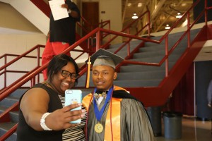 Graduate Xavier Smith of Edwards strike a pose with Janelle Moody of Edwards after receiving his Associate in Arts degree May 14 at Hinds Community College-Utica.