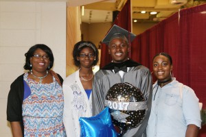 Graduate Nicholas McKinney of Greenville, center, received an Associate in Arts degree May 14 from Hinds Community College-Utica. With him are from left, Lucille Shavers, Markevia Shavers, both of Greenville, and Alexis Hayes of Yazoo City, right.