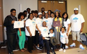 Angel Flagg of Vicksburg is joined by her team of family members and friends at Hinds Community College's nursing and allied health graduation ceremony on May 12.