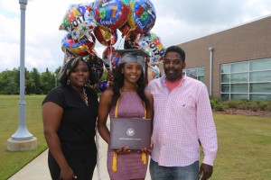 Semaj Brown, of Clinton, holds the Associate of Arts degree in Physical Therapist Assistant Technology presented to her during graduation ceremonies May 12 at the Muse Center at Hinds Community College Rankin Campus. With her is Erica Brown, her mother, left, and James Brown, her father. (Hinds Community College/April Garon)