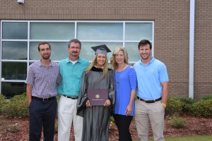 Kennedy Garner, of Brandon, holds the Associate of Arts degree presented to her during graduation ceremonies May 12 at the Muse Center at Hinds Community College Rankin Campus. With her is Kyle Garner, left, a brother, Scott Garner, her father, Rhonda Garner, her mother, and Kreg Garner, a brother. (Hinds Community College/April Garon)