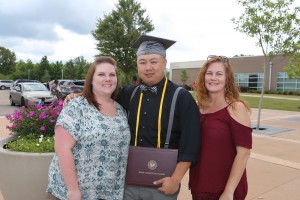 Wayne Dang, of Pearl, holds the Associate of Applied Science degree in Computer Network Technology presented to him during graduation ceremonies May 12 at the Muse Center at Hinds Community College Rankin Campus. With him is Brianne Blair, left, his fiancé, and Jacqueline Blair, Brianne’s mother. 