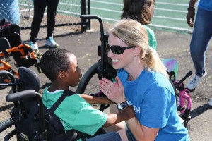 Raymond Elementary student Kaleb Washington is happy to see Hinds County schools physical therapist Larina Mason, organizer of the annual field day held each year at Hinds Community College.