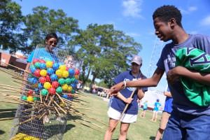 Cleveland Hunter, 19, a Raymond High student, watches to see how many balls fall when he pulls the stick. He was at the “Let Your Light Shine On” field day for Hinds County special education students on May 2 at Hinds Community College. (Hinds Community College/April Garon)