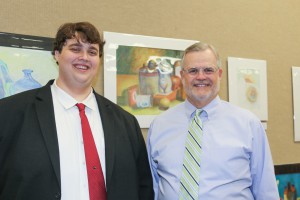 Tyler Tatum, left, a Distinguished Honors Scholar, with Business Administration Instructor Mike Clark