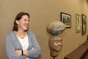 Sarah Teasley, director of the Marie Hull Art Gallery on the Raymond Campus of Hinds Community College, shows one of her pieces. (Tammi Bowles/Hinds Community College)